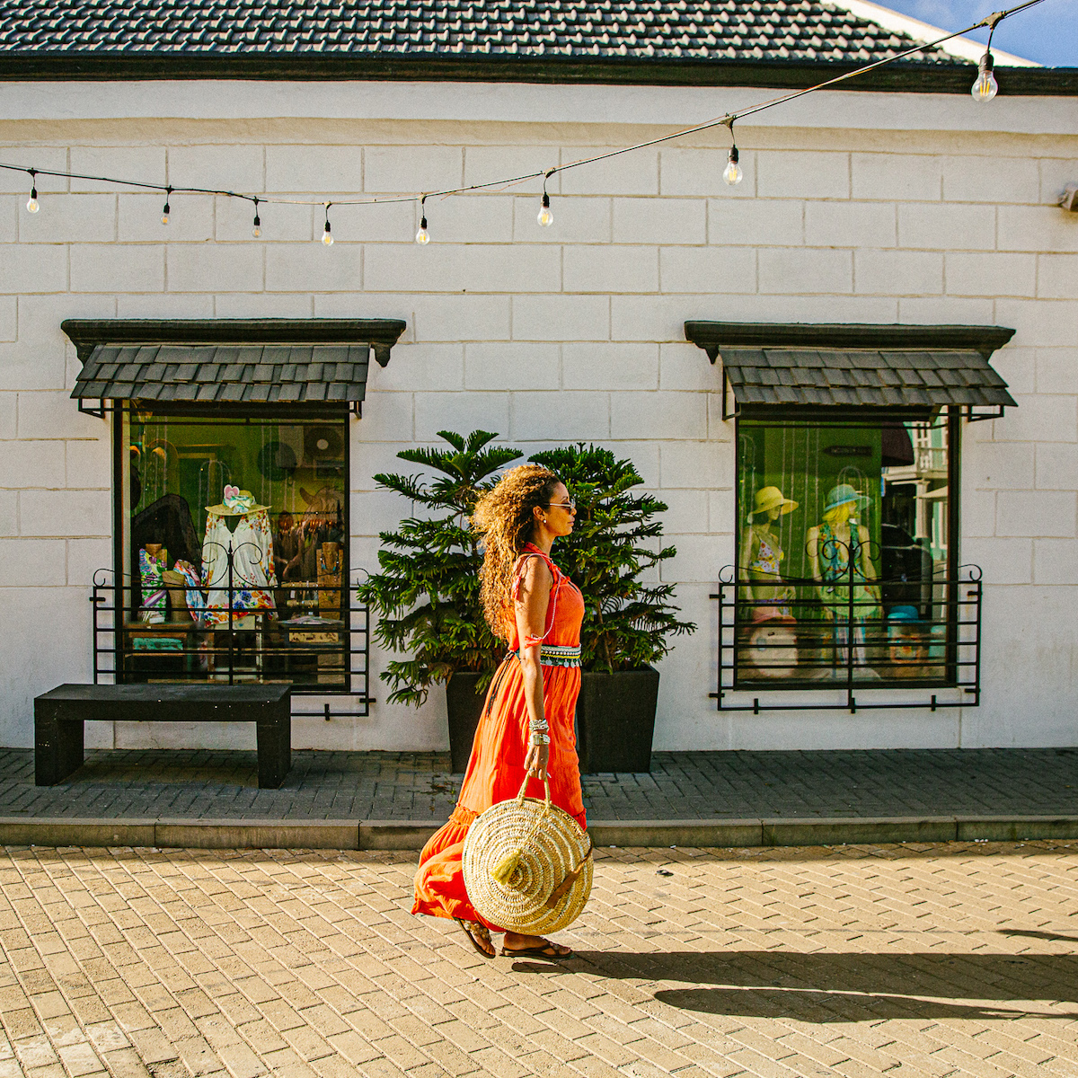 Woman walking near storefront