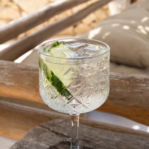 Sparkling cocktail with lime on table