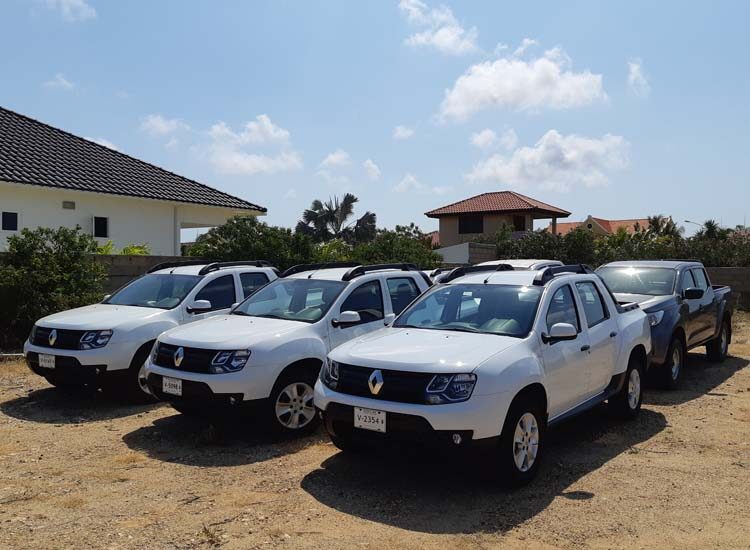 SUVs and pickup trucks parked next to each other