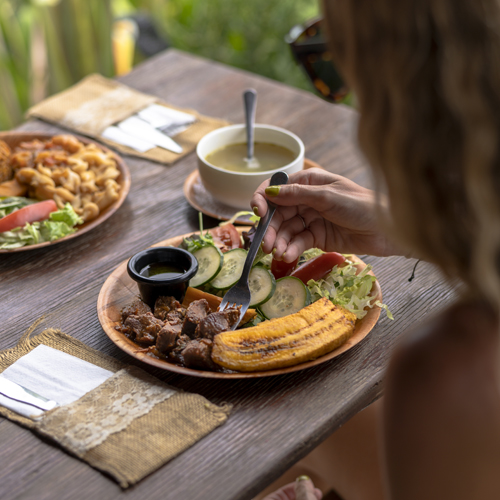 Woman eating plate of food