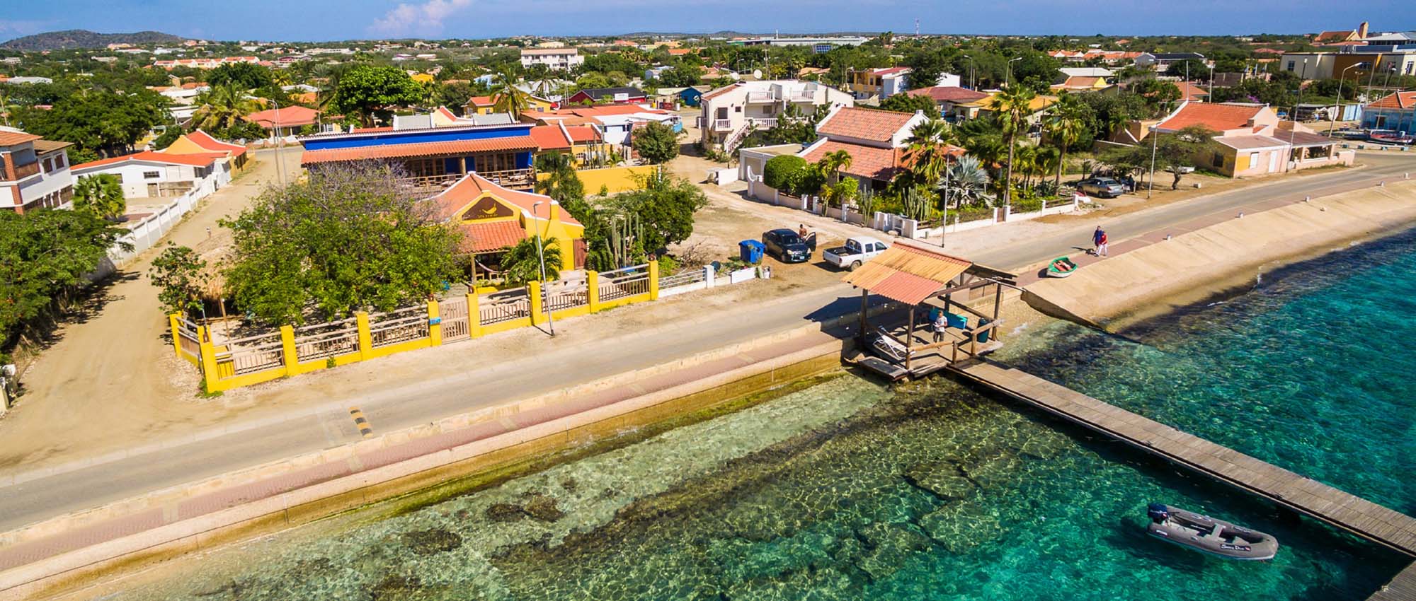 Aerial view of property by the ocean
