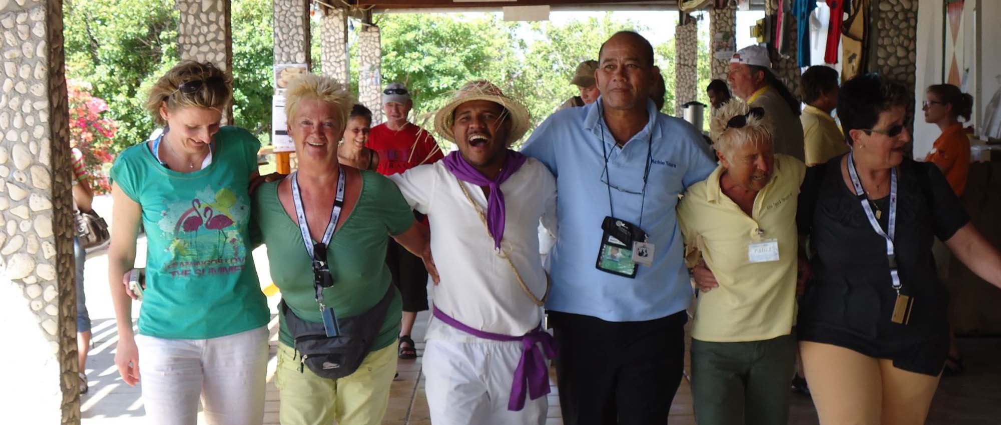 Tourists and tour guide lined up for a picture