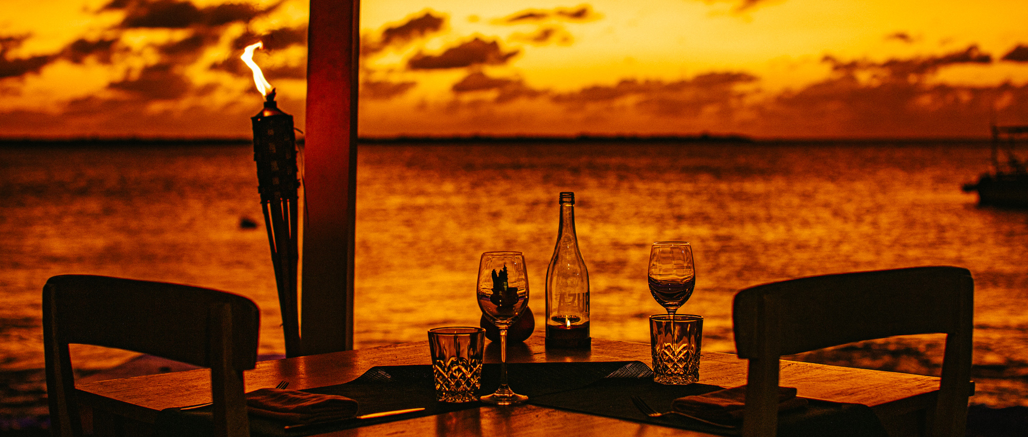 Table setting with wine at sunset