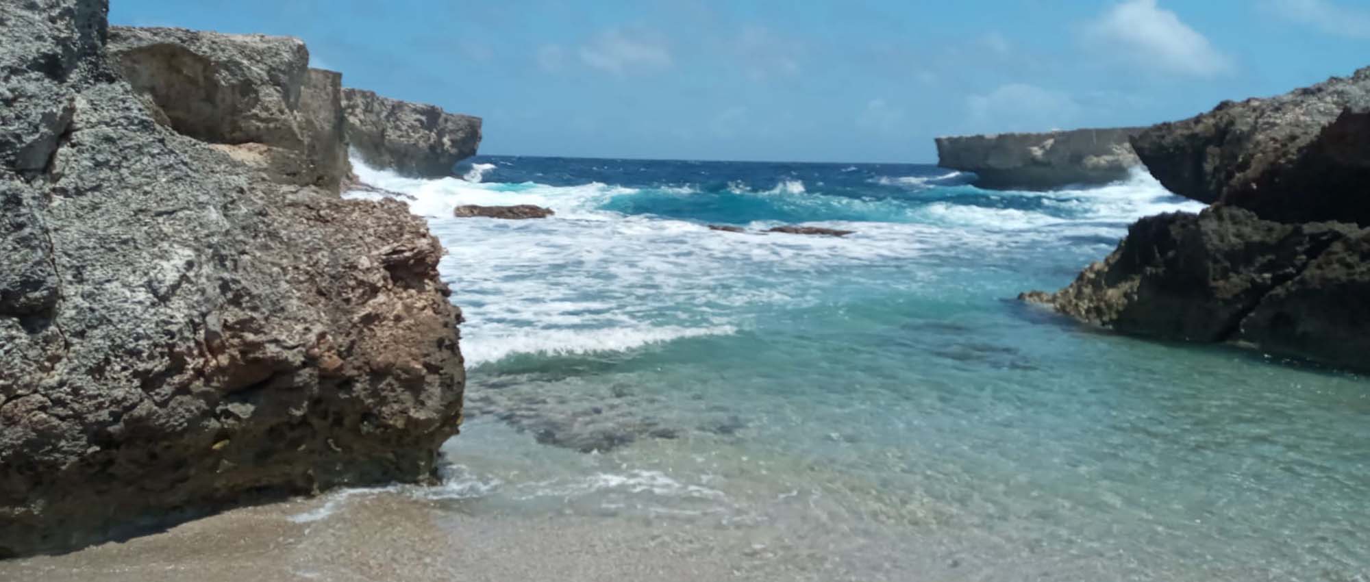 Waves splashing on rocks in sea shore