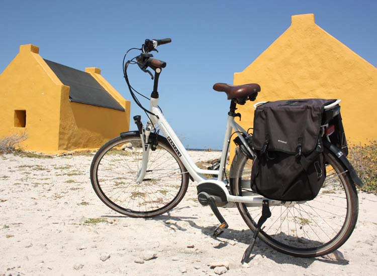 Bike in front of slave huts