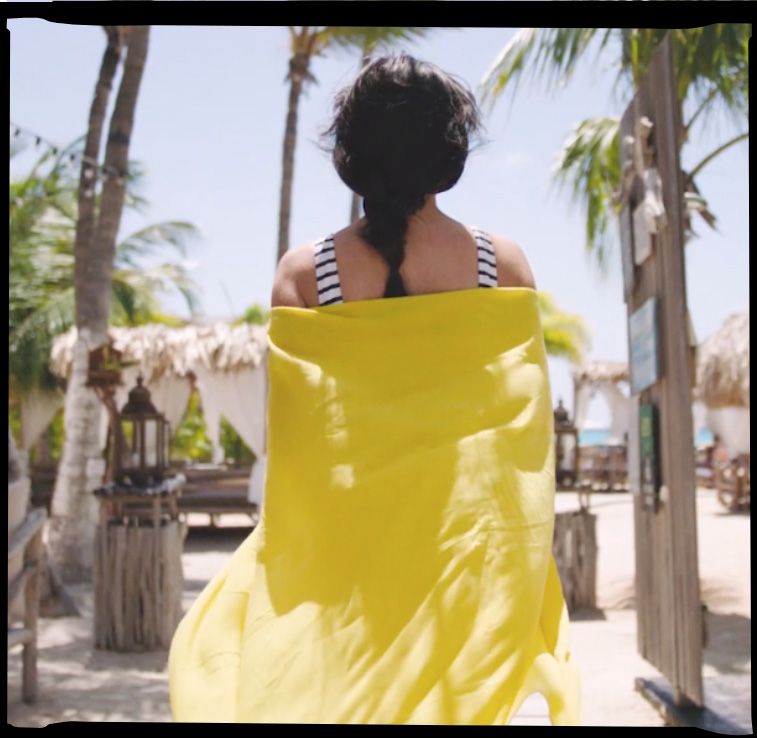 Women walking in a yellow cover-up